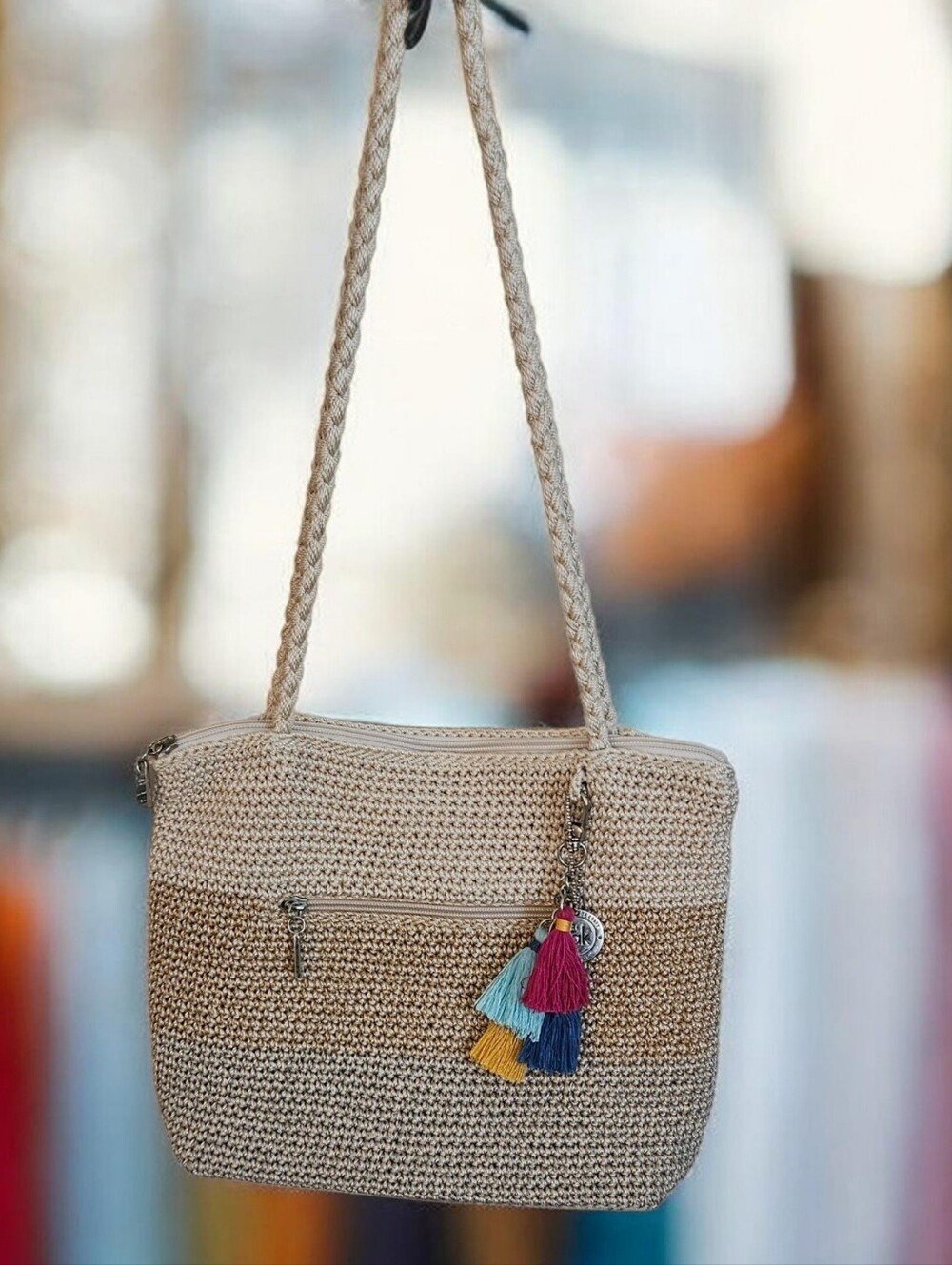 The 30 Year Limited Edition Sak Beige Woven Crossbody With Charm.